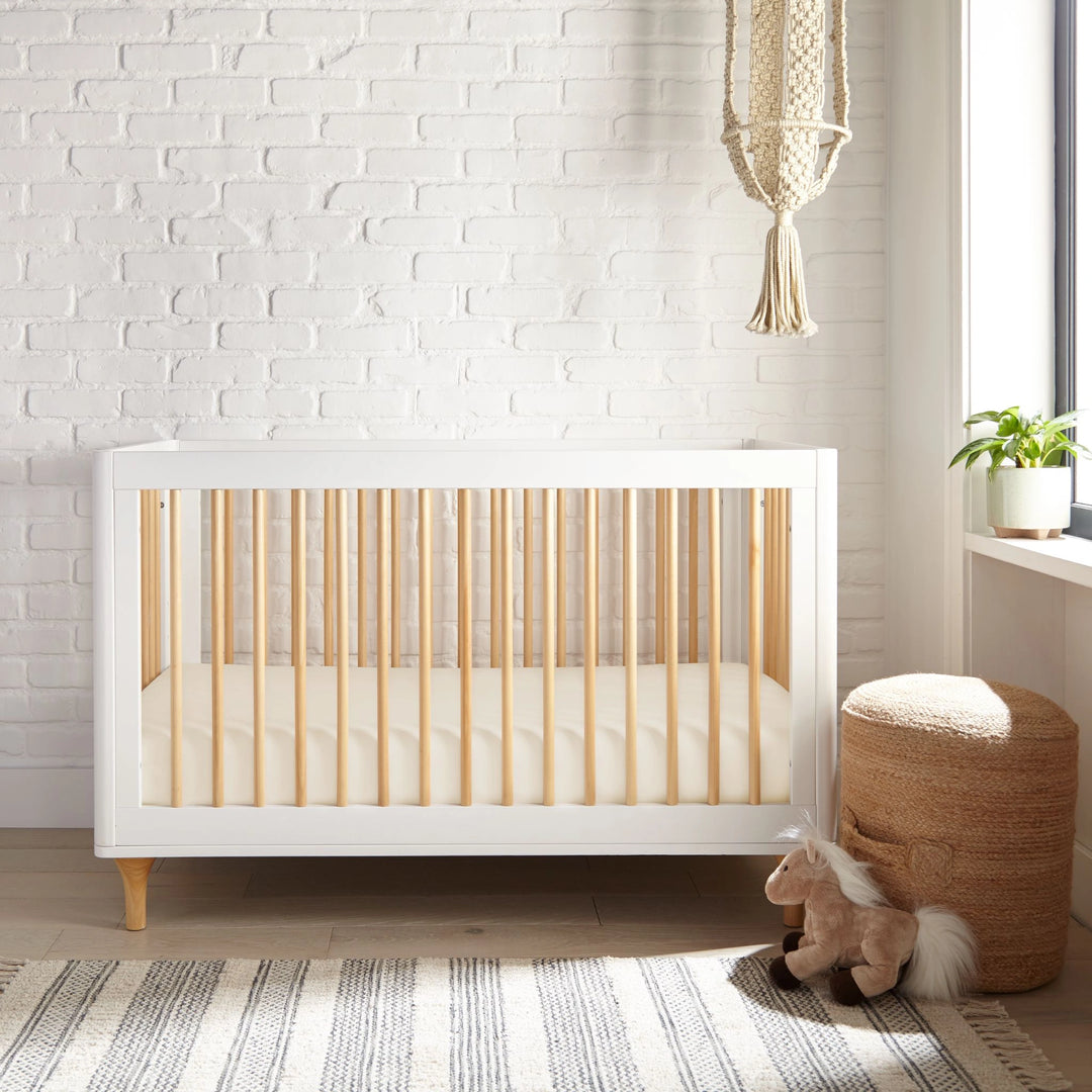 ivory bamboo crib fitted sheet from the Signature Collection, styled in a bright nursery with white crib and natural light
