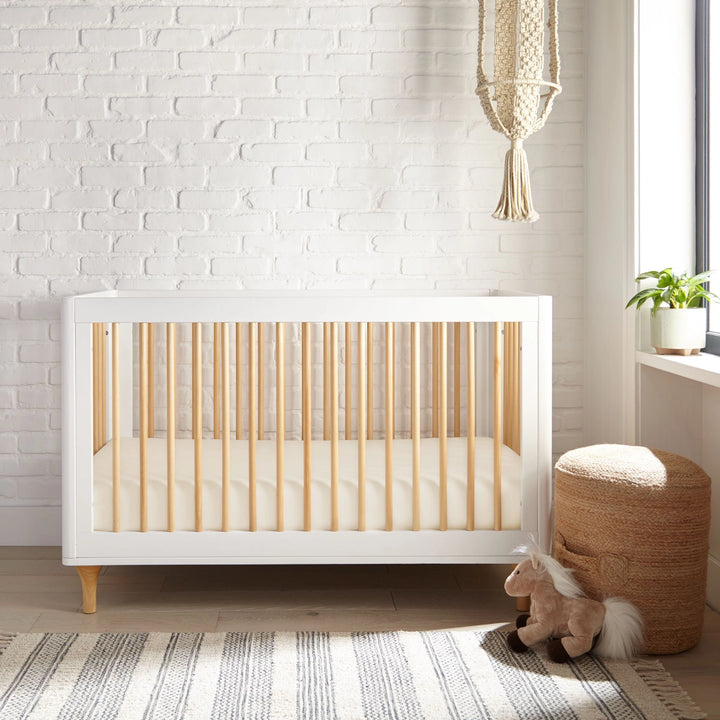 ivory bamboo crib fitted sheet from the Signature Collection, styled in a bright nursery with white crib and natural light