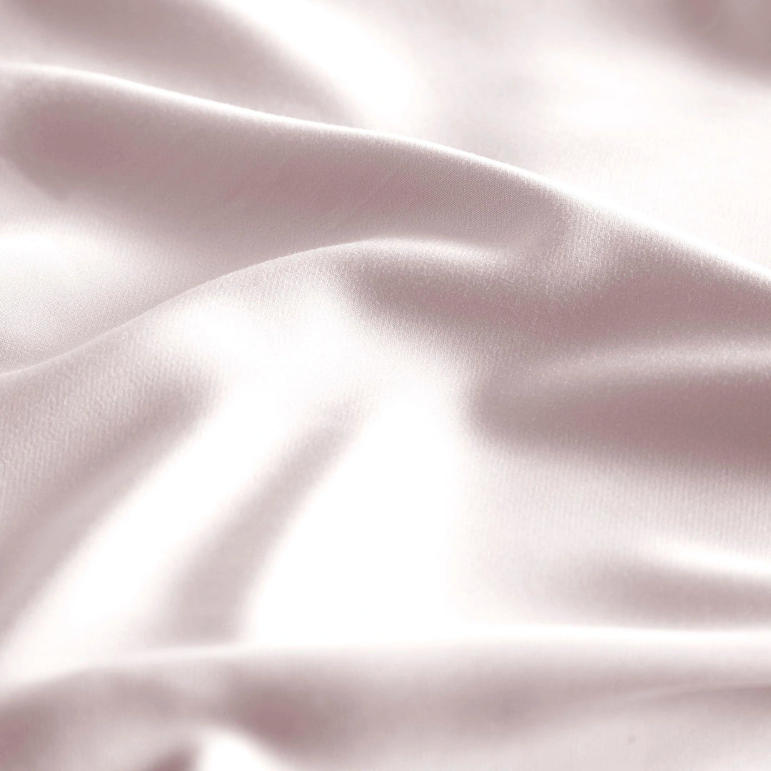 close-up of mauve bamboo bed sheets with sateen weave from the Premium Collection, highlighting silky texture and smooth drape
