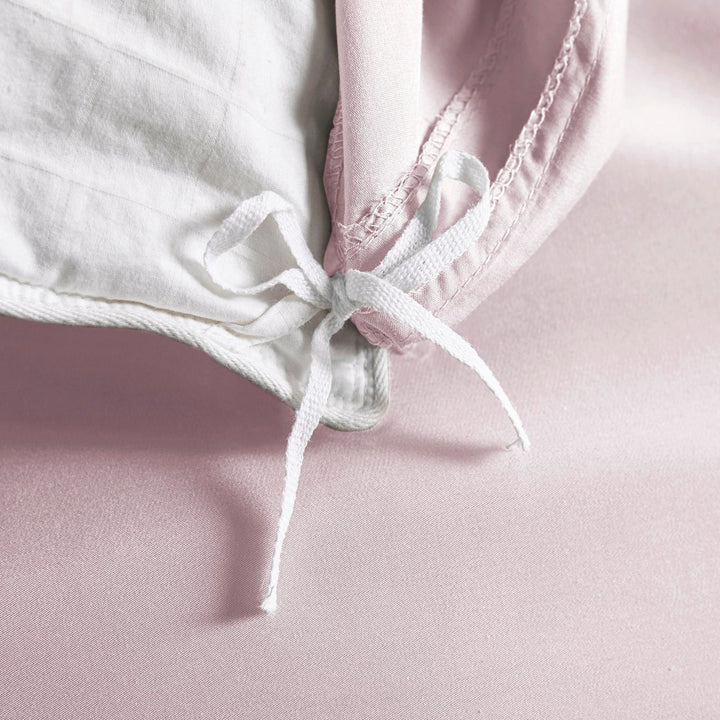 mauve bamboo duvet cover from the Premium Collection, close-up of internal corner tie securing mauve insert with smooth sateen fabric