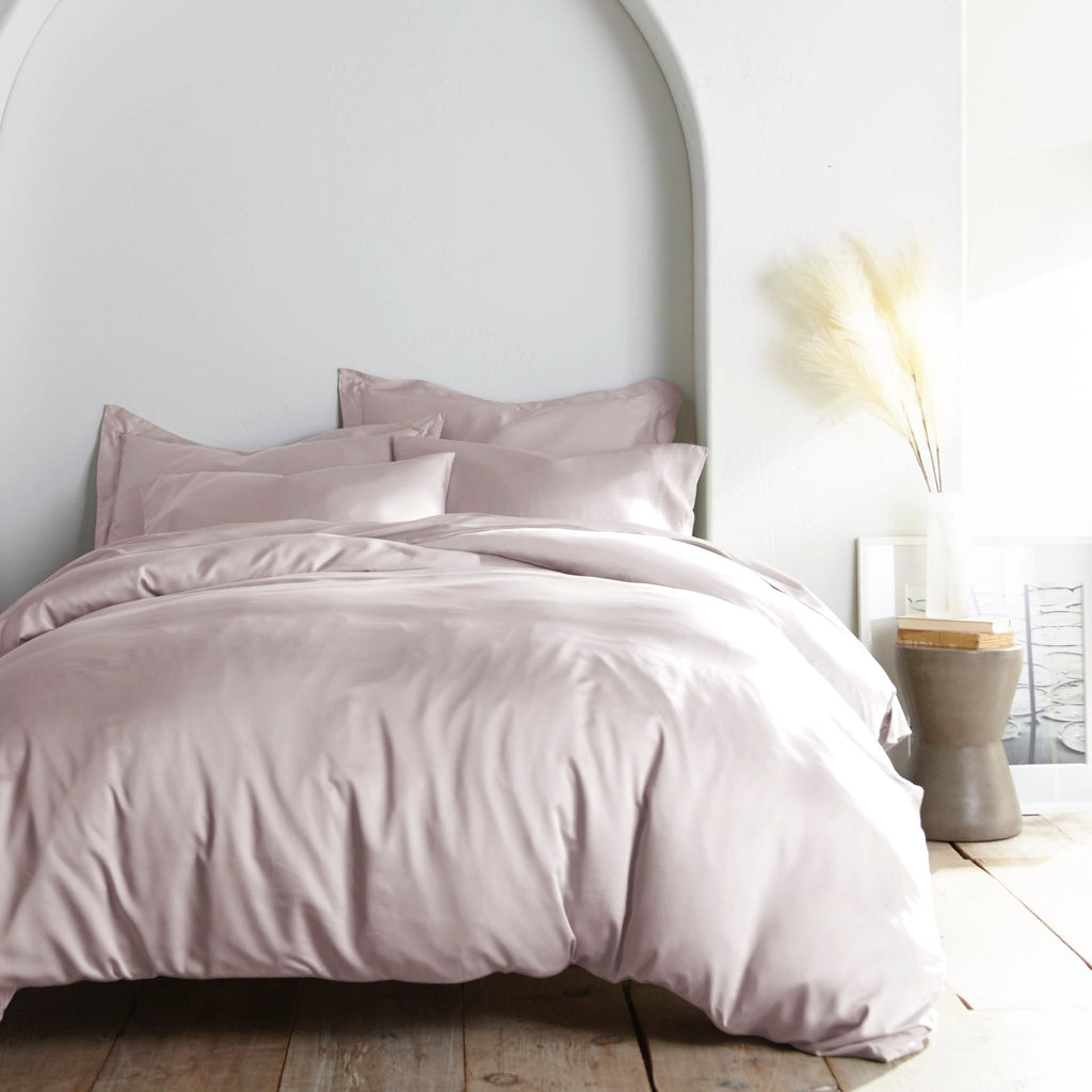mauve bamboo bed sheets with sateen weave from the Premium Collection, shown foot view with matching pillowcases and a modern nightstand