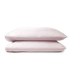 mauve bamboo pillowcases from the Premium Collection, clean stacked display on mauve background with stitching detail visible