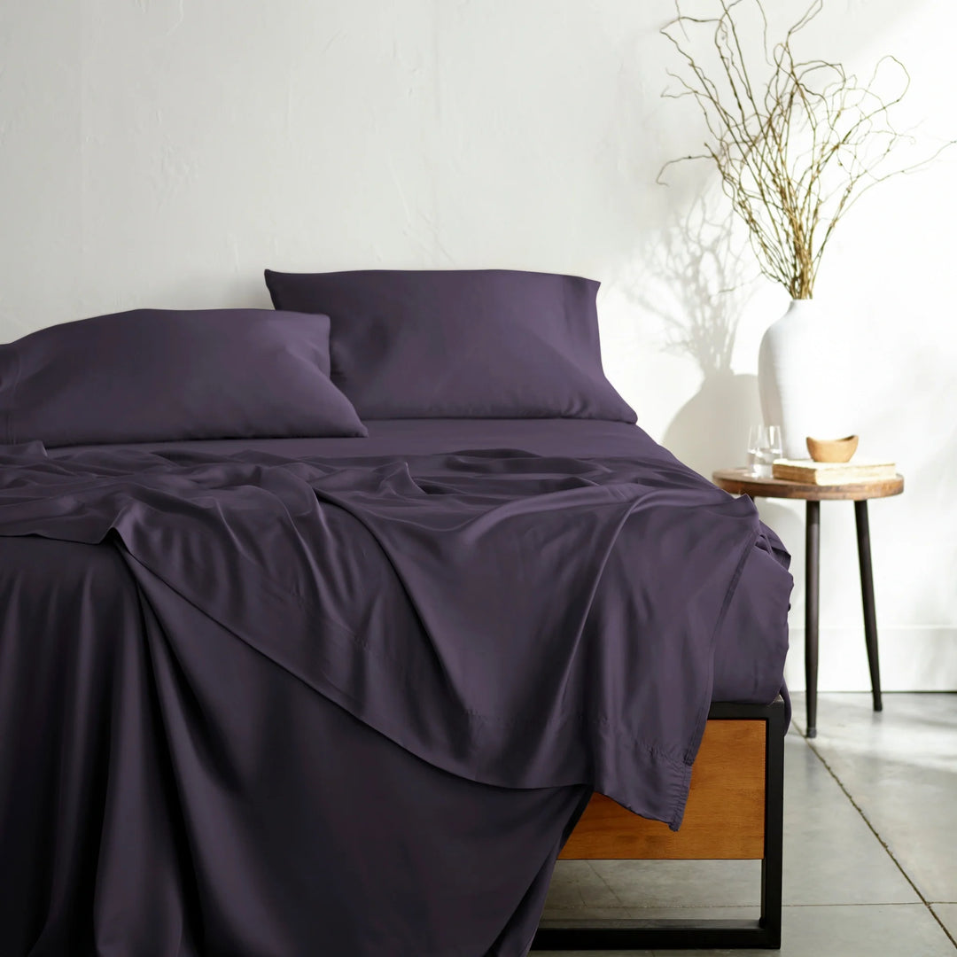 royal purple bamboo bed sheets from the Signature Collection, shown from the foot of the bed — the same sheets supplied in Split Cal King