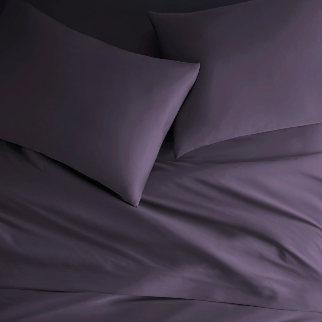 royal purple bamboo bed sheets with sateen weave from the Signature Collection, overhead view highlighting smooth texture and matching pillowcases