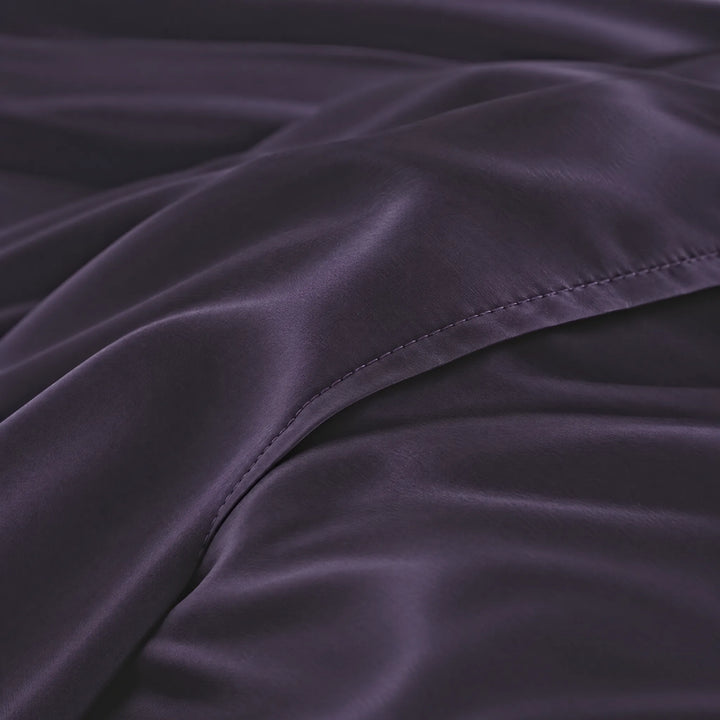Royal Purple bamboo viscose sateen body pillowcase macro close-up of silky sateen folds and stitched envelope closure