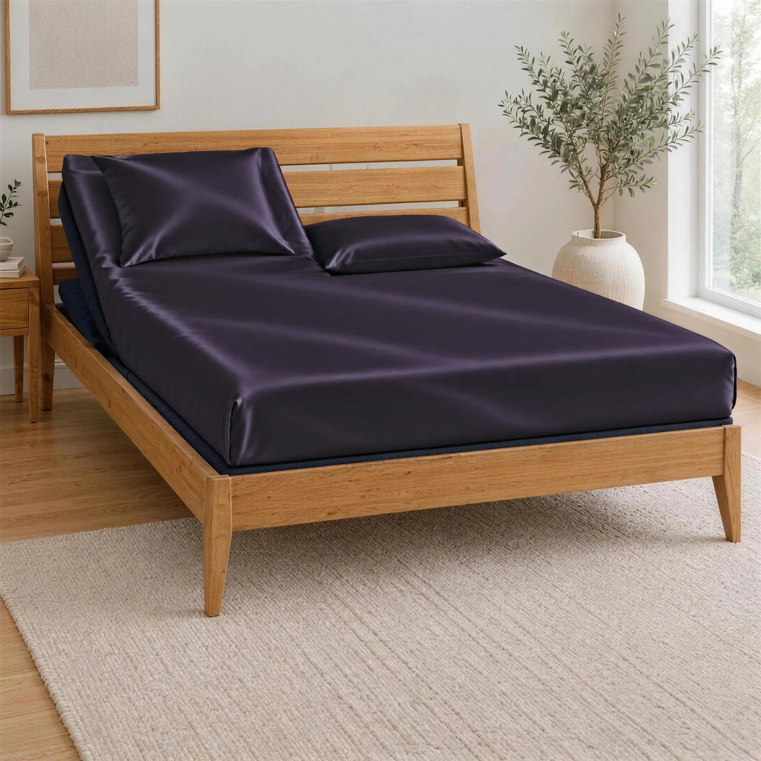 Royal Purple bamboo viscose Signature fitted sheet on a Top Split King bed: one mattress split at the head only, on an adjustable base in a bamboo frame, left head section raised