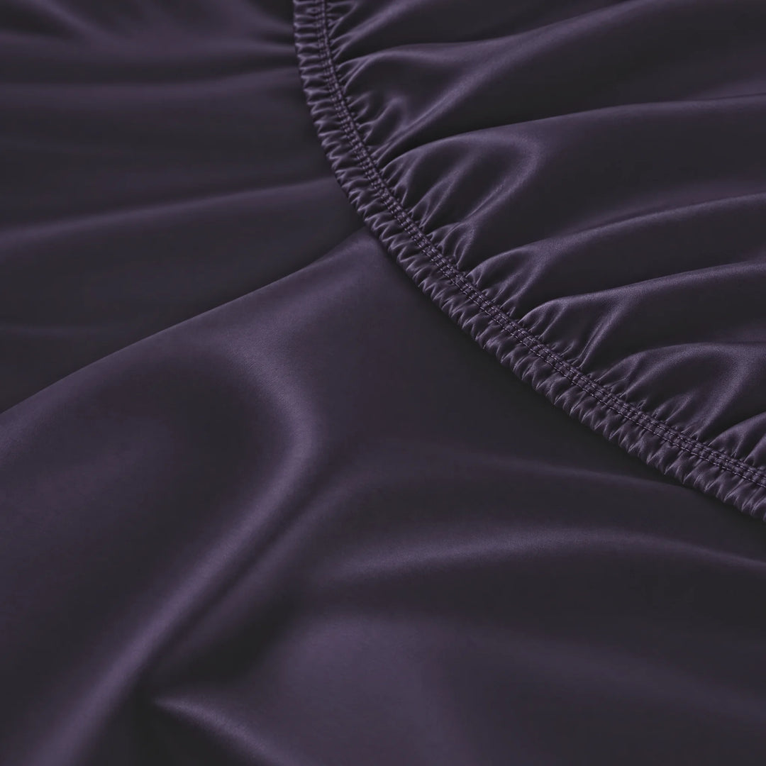 Royal Purple bamboo viscose fitted sheet stitched elastic hem macro close-up of smooth silky sateen, from the sheet set
