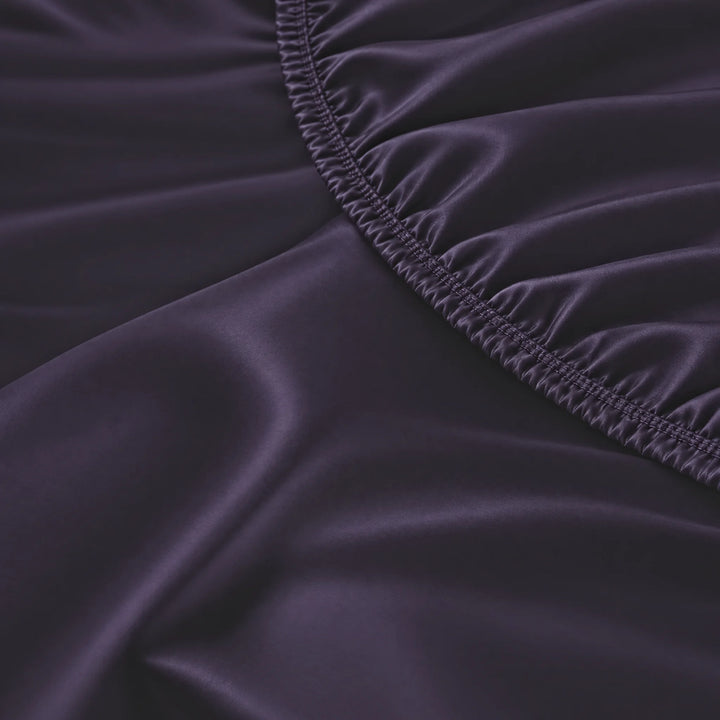 Royal Purple bamboo viscose fitted sheet stitched elastic hem macro close-up of smooth silky sateen, from the sheet set