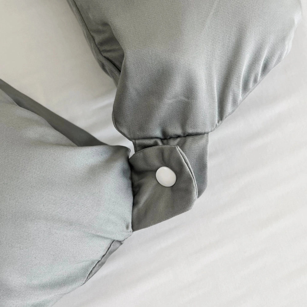 Close-up of the silver travel pillowcase with a secure lock button closure for easy packing and protection