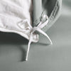 silver bamboo duvet cover from the Signature Collection, close-up of internal corner tie securing white insert with smooth sateen fabric