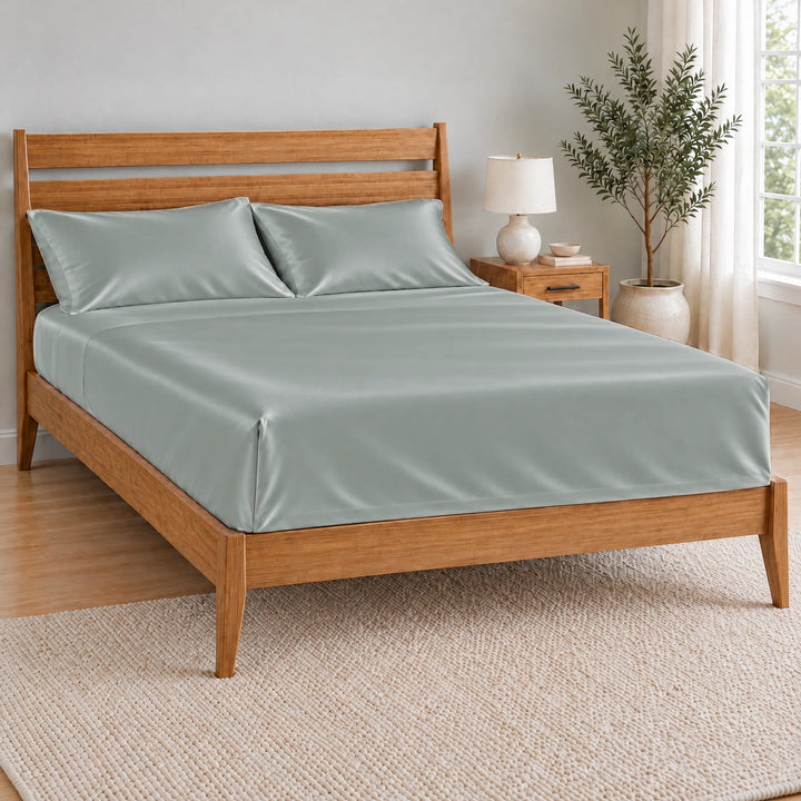 Silver bamboo viscose flat sheet tucked with a neat hospital corner on a bamboo bed