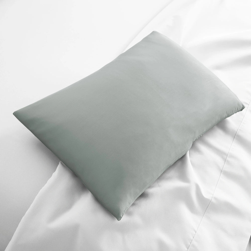 silver bamboo lumbar pillowcase from the Signature Collection, displayed flat on white bedding with sateen finish and soft texture