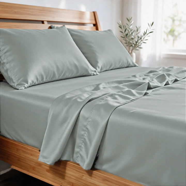Silver bamboo viscose sateen pillowcases close-up in morning light, showing the soft sheen