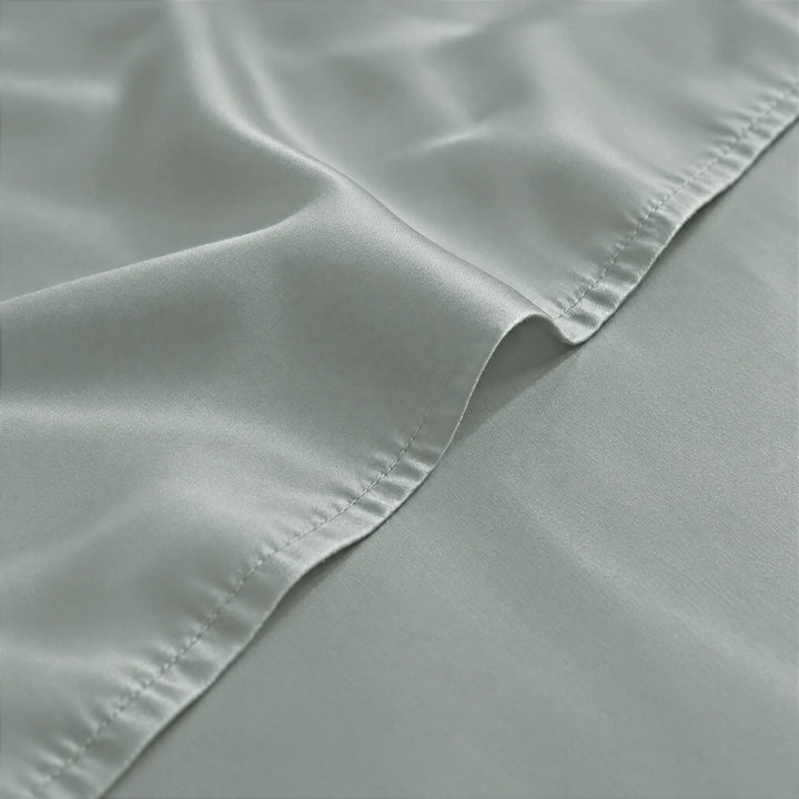 Silver bamboo viscose sateen weave close-up with hem stitching