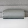 Silver travel-size bolster pillow made with soft, supportive materials for on-the-go neck and lumbar comfort