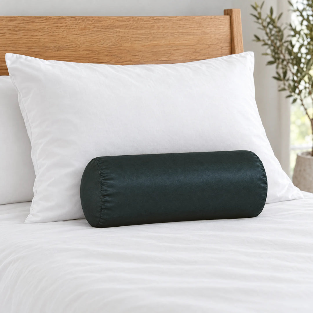 Slate bamboo viscose sateen bolster pillowcase (18 x 8 in) in front of a queen pillow to show true size