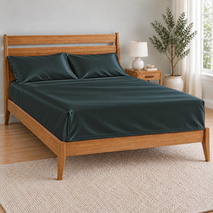 Slate bamboo viscose flat sheet tucked with a neat hospital corner on a bamboo bed