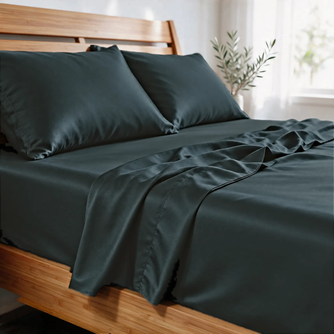Slate bamboo viscose sateen pillowcases close-up in morning light, showing the soft sheen