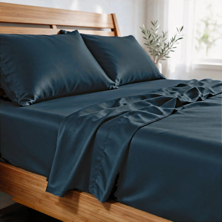 Slate bamboo viscose sateen pillowcases close-up in morning light, showing the soft sheen