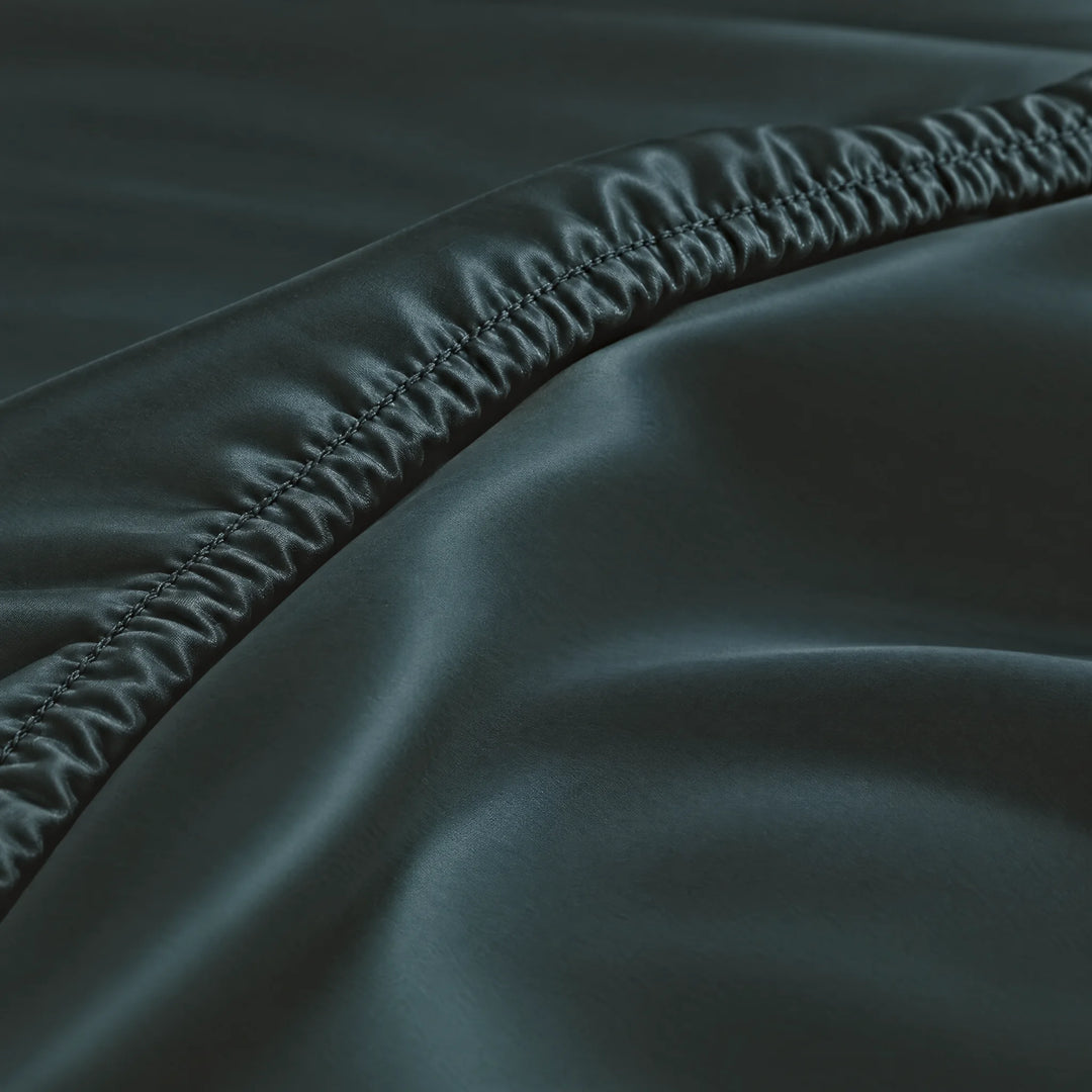 Slate bamboo viscose fitted sheet stitched elastic hem macro close-up of smooth silky sateen, from the sheet set