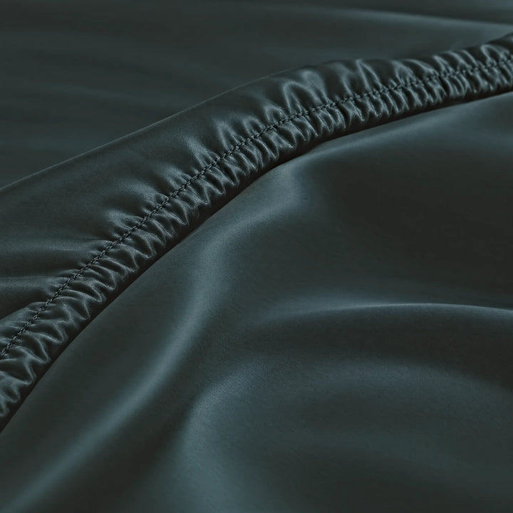 Slate bamboo viscose fitted sheet stitched elastic hem macro close-up of smooth silky sateen, from the sheet set