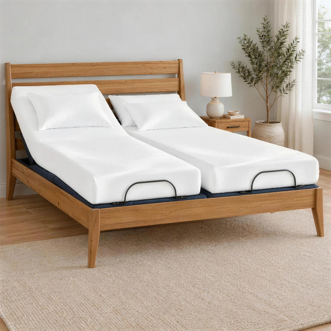 White bamboo viscose Split King sheets on two separate twin XL mattresses on the Bamboo Is Better BT3000 Split King adjustable base inside a Greenington Sienna bamboo frame, left side raised