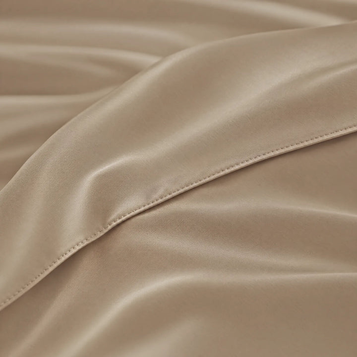 Taupe bamboo viscose sateen body pillowcase macro close-up of silky sateen folds and stitched envelope closure