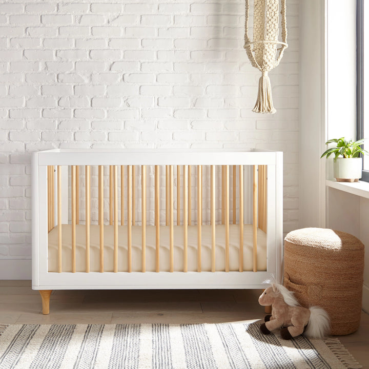 taupe bamboo crib fitted sheet from the Signature Collection, styled in a bright nursery with white crib and natural light
