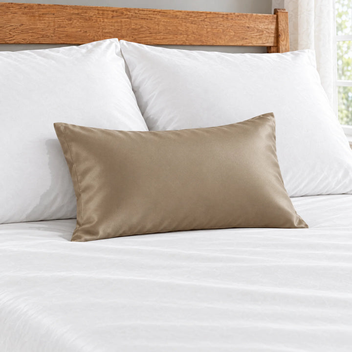 Taupe bamboo viscose sateen lumbar pillowcase close-up on white bedding showing the silky sateen finish and stitched hem