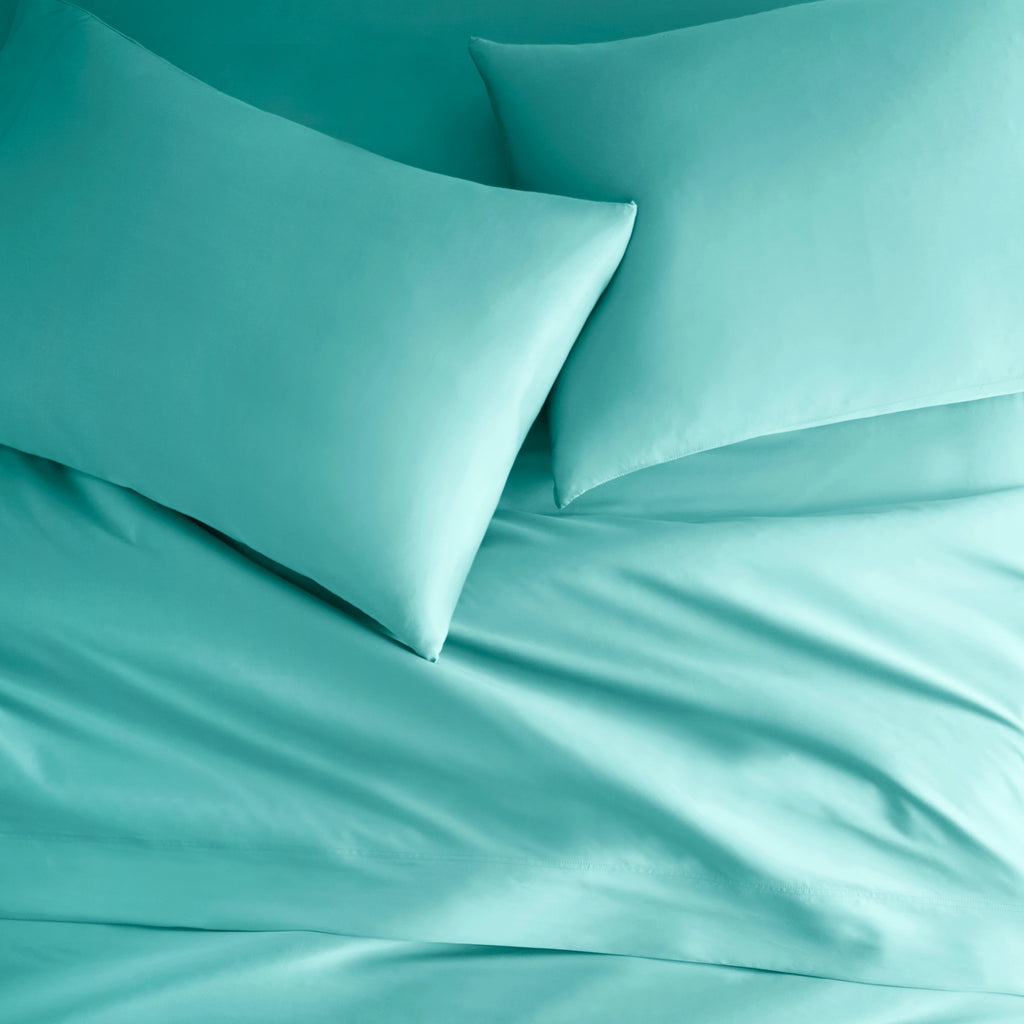 tiffany blue bamboo bed sheets with sateen weave from the Signature Collection, overhead view highlighting smooth texture and matching pillowcases