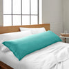 tiffany blue bamboo body pillow from the Signature Collection, shown on a tiffany blue bed in a bright modern bedroom with natural light and wood headboard