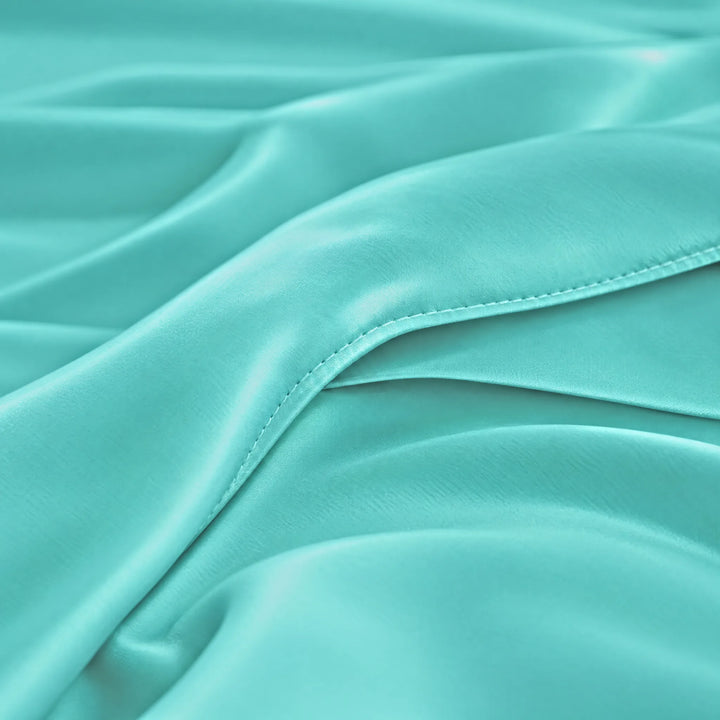 Tiffany Blue bamboo viscose sateen body pillowcase macro close-up of silky sateen folds and stitched envelope closure