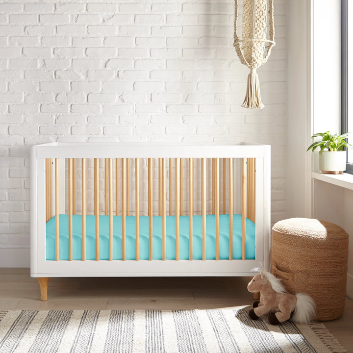 tiffany blue bamboo crib fitted sheet from the Signature Collection, styled in a bright nursery with tiffany blue crib and natural light