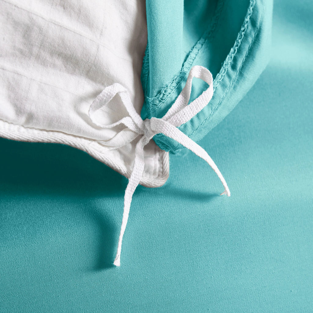 tiffany blue bamboo duvet cover from the Signature Collection, close-up of internal corner tie securing tiffany blue insert with smooth sateen fabric