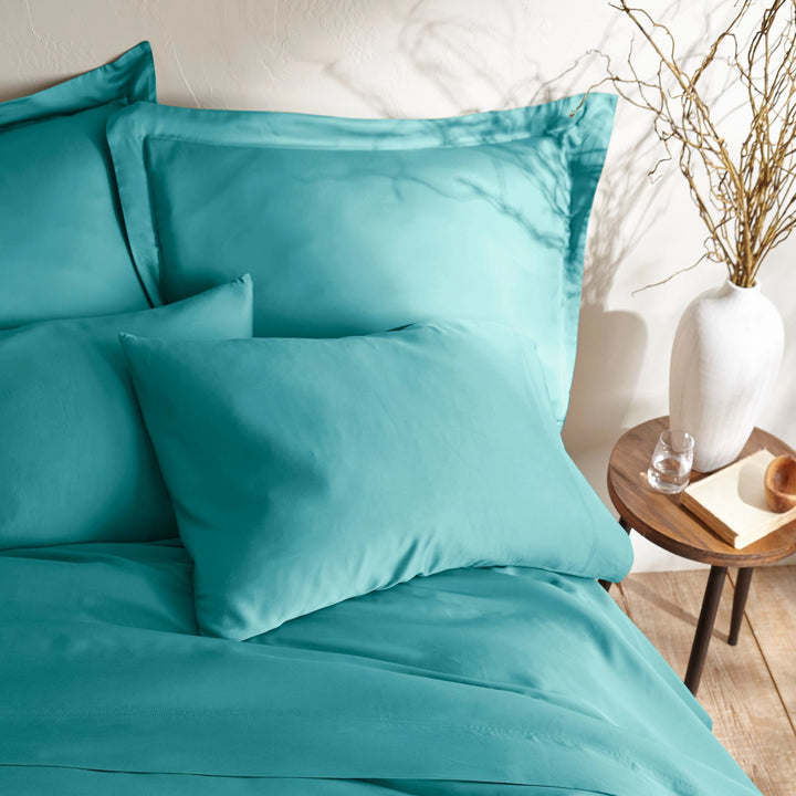 tiffany blue bamboo bed sheets with sateen weave from the Signature Collection, overhead view highlighting smooth texture and matching pillowcases