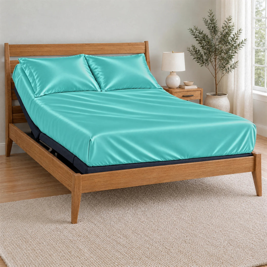 Tiffany Blue bamboo viscose Signature fitted sheet on a made bed with a bamboo frame and nightstand in a bright bedroom