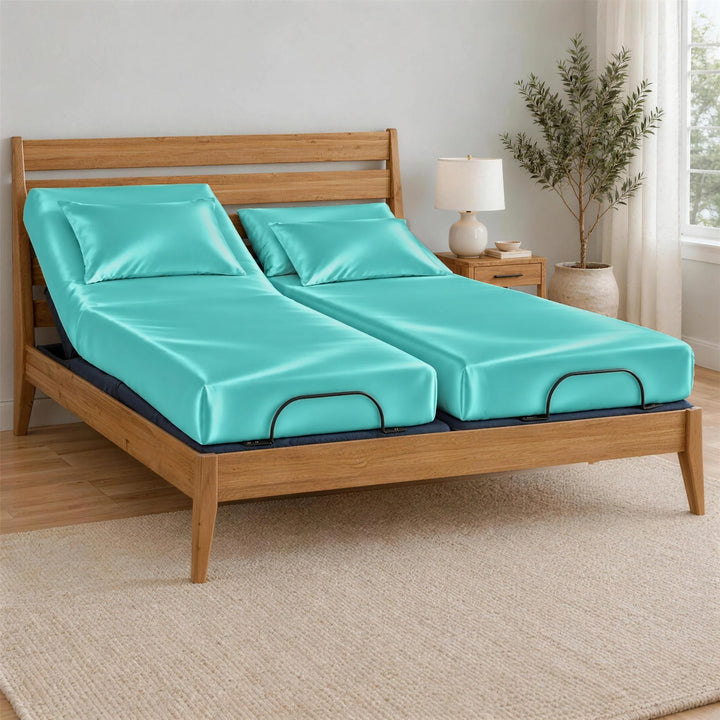 Tiffany Blue bamboo viscose Signature fitted sheets on a Split King bed: two separate mattresses, each with its own fitted sheet, on an adjustable base in a bamboo frame, left side raised
