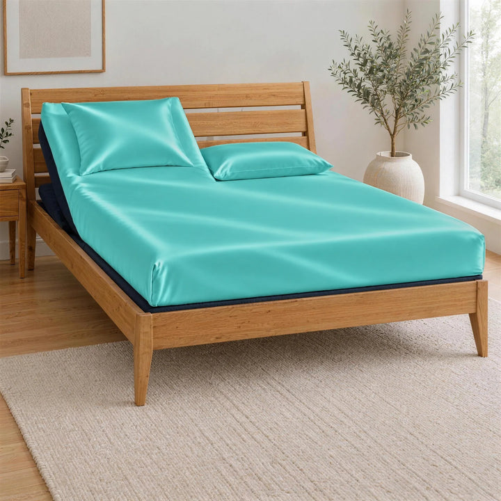 Tiffany Blue bamboo viscose Signature fitted sheet on a Top Split King bed: one mattress split at the head only, on an adjustable base in a bamboo frame, left head section raised