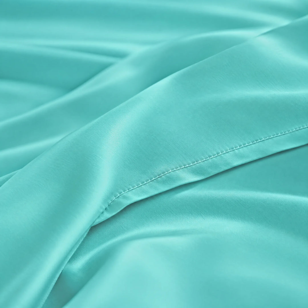 Tiffany Blue bamboo viscose sateen lumbar pillowcase macro close-up of silky sateen folds and stitched hem
