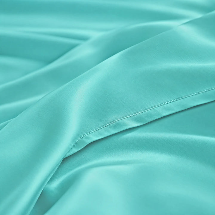 Tiffany Blue bamboo viscose sateen lumbar pillowcase macro close-up of silky sateen folds and stitched hem