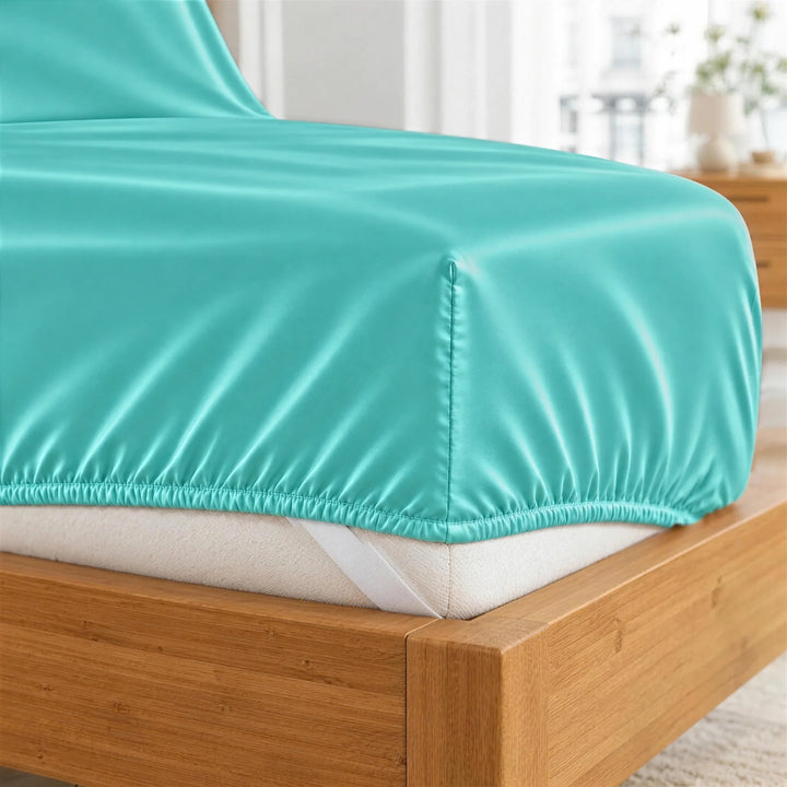 Tiffany Blue bamboo viscose fitted sheet deep-pocket corner close-up with all-around elastic and a corner strap, from the sheet set