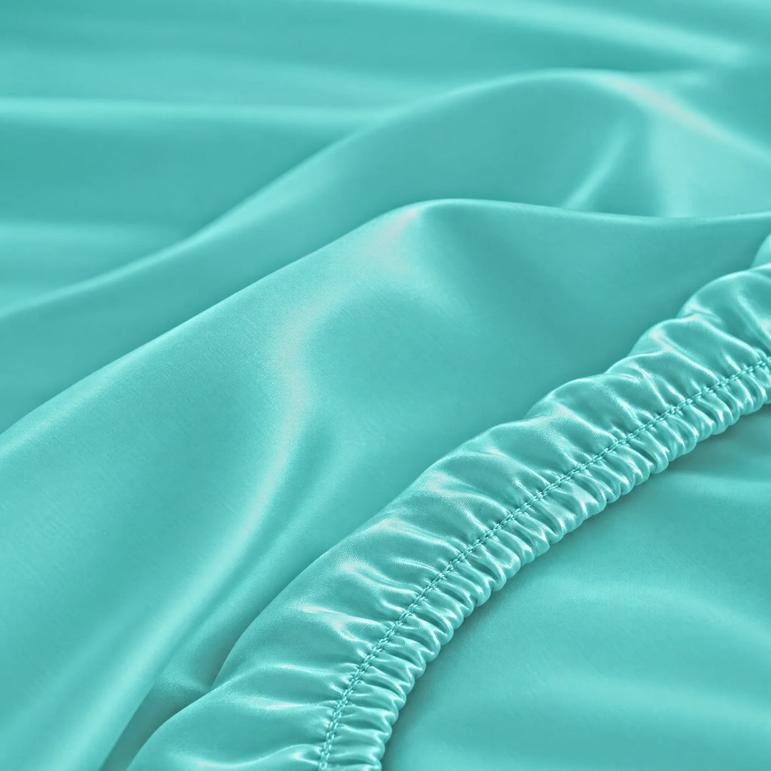 Tiffany Blue bamboo viscose fitted sheet stitched elastic hem macro close-up of smooth silky sateen, from the sheet set