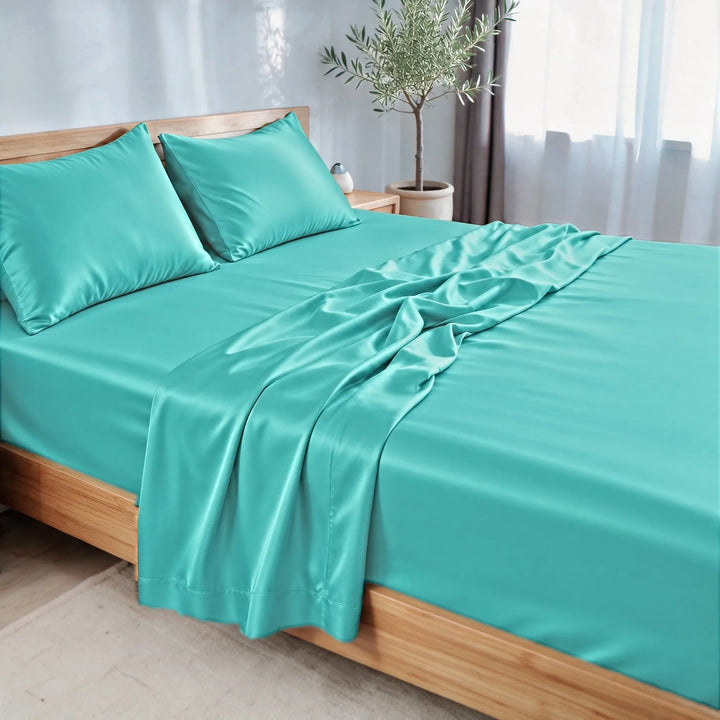 Tiffany Blue bamboo viscose sateen sheet set, three-quarter view with the flat sheet pulled back over the fitted sheet