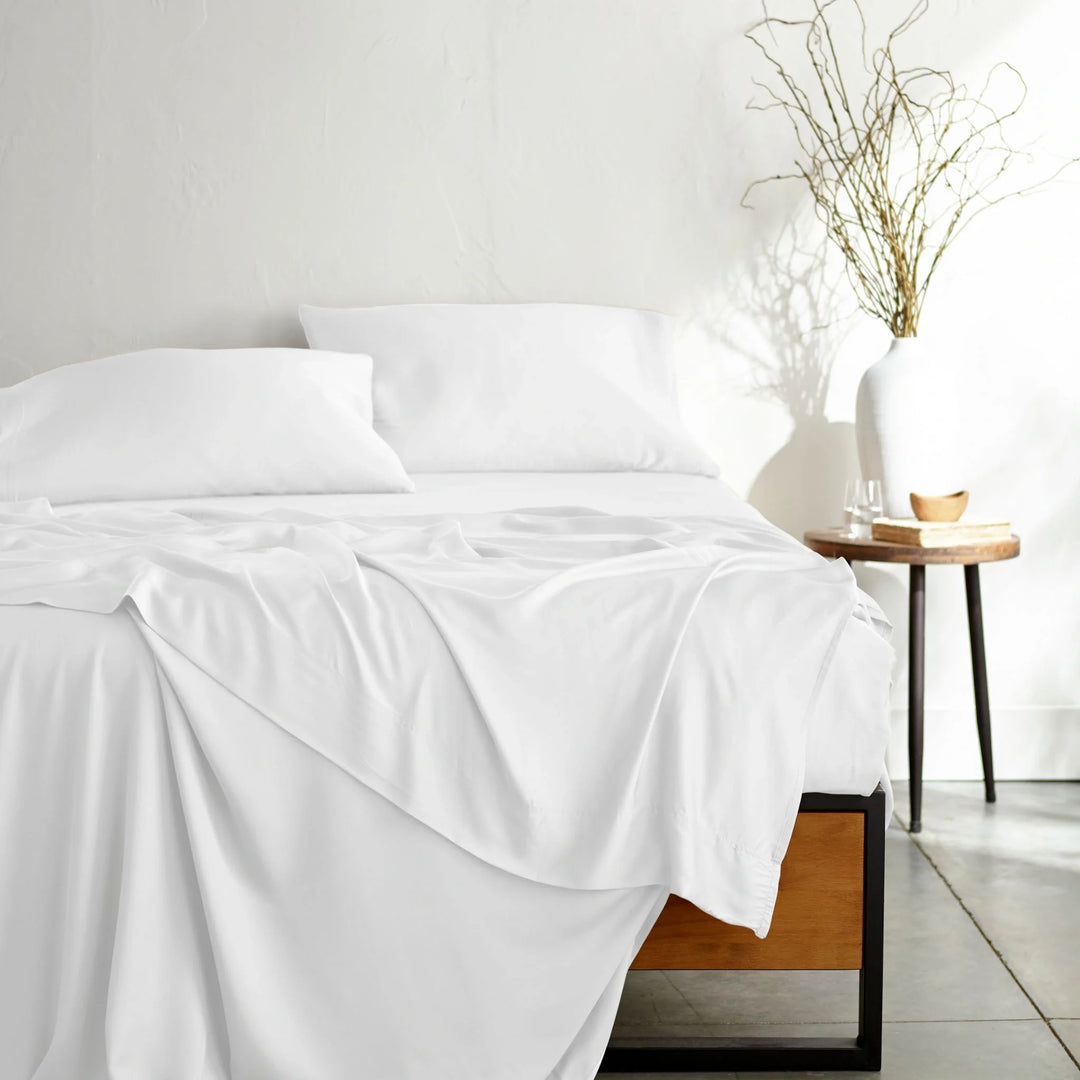 white bamboo bed sheets from the Signature Collection, shown from the foot of the bed — the same sheets supplied in Split Queen