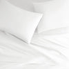white bamboo bed sheets with sateen weave from the Signature Collection, overhead view highlighting smooth texture and matching pillowcases