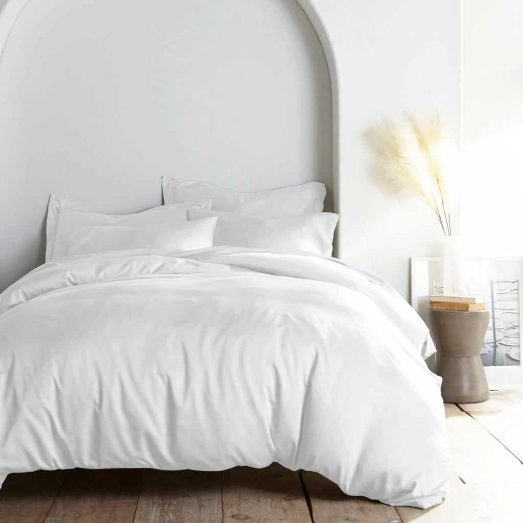 white bamboo bed sheets with sateen weave from the Signature Collection, shown foot view with matching pillowcases and a modern nightstand