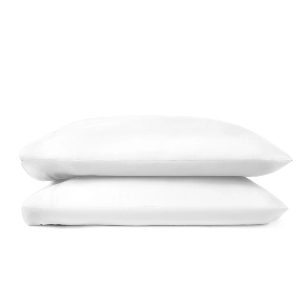 white bamboo pillowcases from the Signature Collection, clean stacked display on white background with stitching detail visible