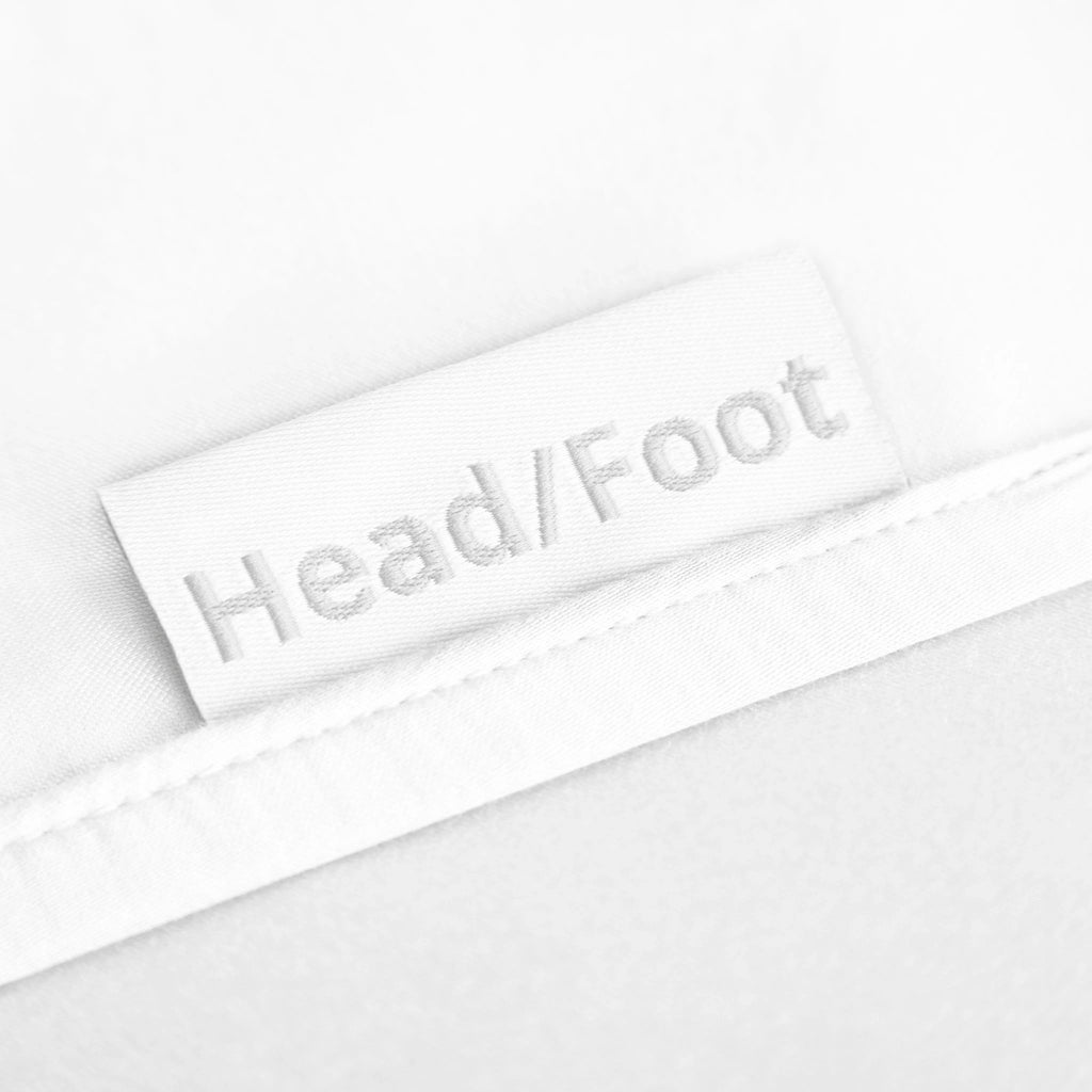 White bamboo bed sheets featuring clearly labeled head and foot tags for effortless bed-making and a perfect fit