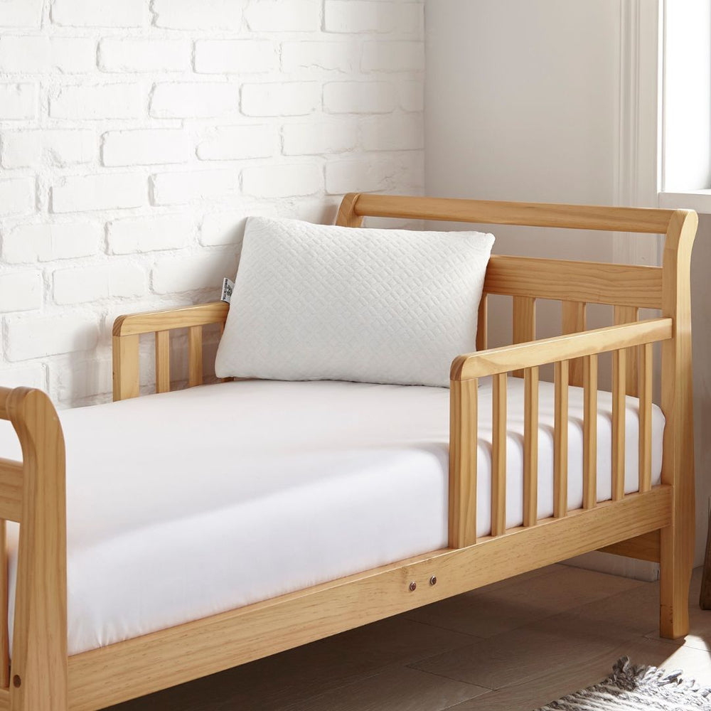 Toddler pillow in crib setting showcasing soft, safe sleep environment